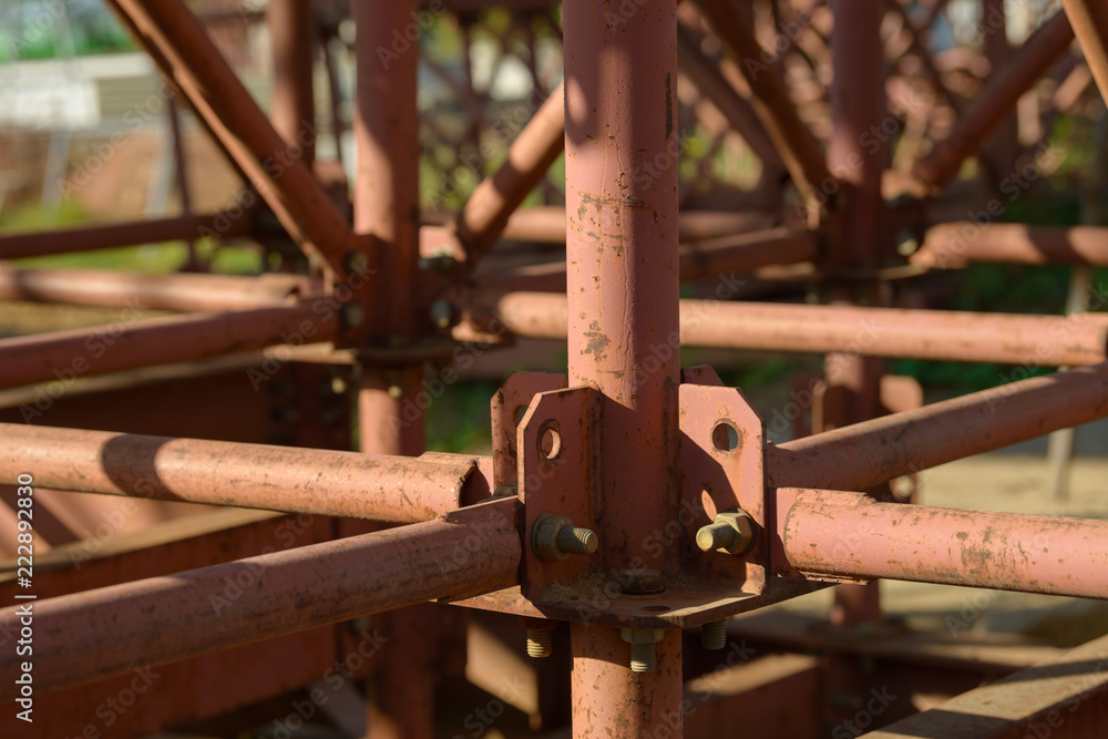 Scaffolding Elements Construction. Metal scaffolding tubes and bars. Construction site details. Bridge support. Scaffolding Elements Construction. Metal scaffolding tubes and bars. Construction site details. Bridge support.