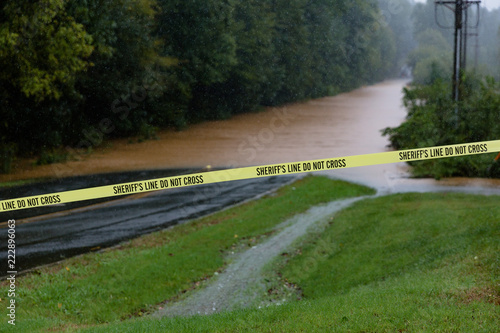 Waxhaw, North Carolina - September 16, 2018: Rainwater from Hurricane Florence floods a roadway