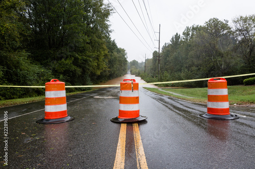 Waxhaw, North Carolina - September 16, 2018: Barricades block a roadway flooded by rain from Hurricane Florence
