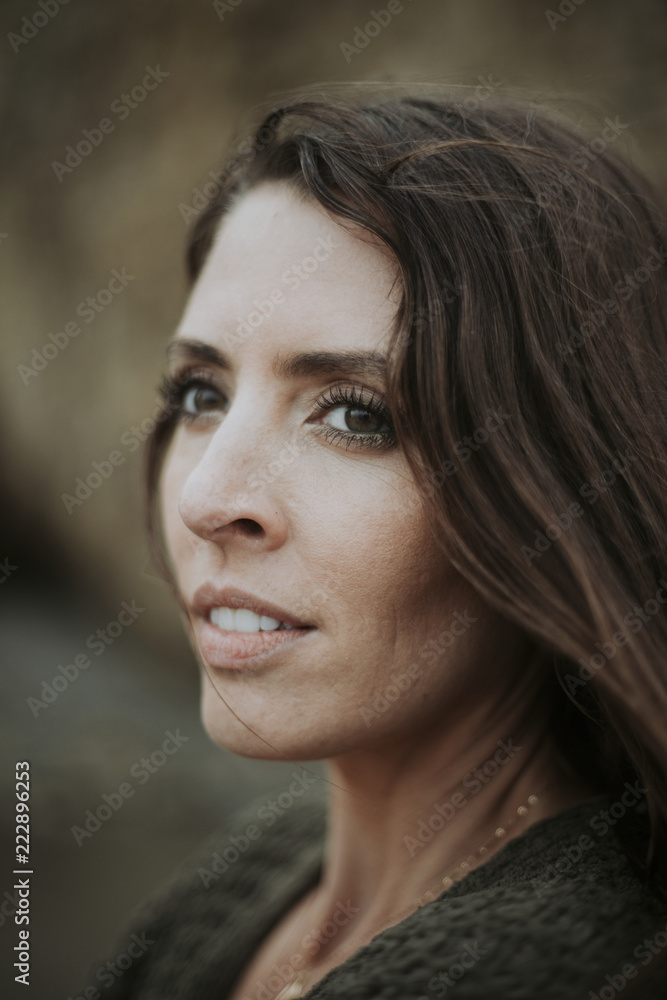 Fototapeta premium Cheerful woman standing outdoor alone