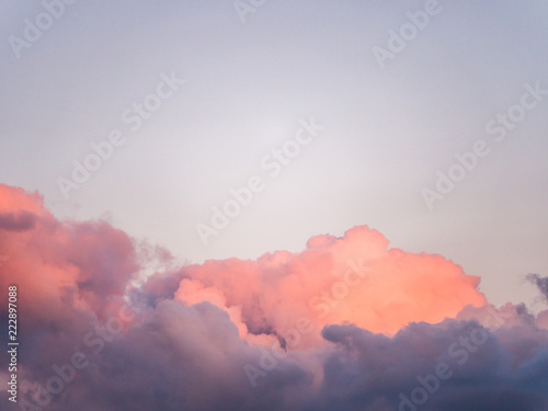 Fototapeta Naklejka Na Ścianę i Meble -  Gorgeous close up view of fluffy cumulus clouds with pink and purple hues resembling delicious mouthwatering cotton candy.
