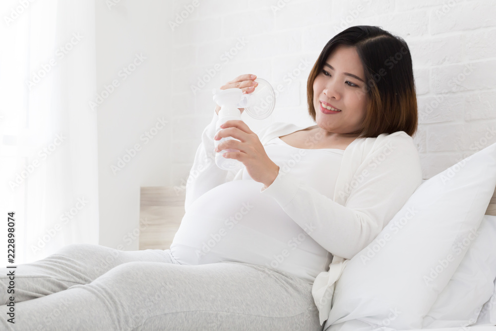 Asian pregnant women choosing a breast pump milk before give birth Asian pregnant women choosing a breast pump milk before give birth