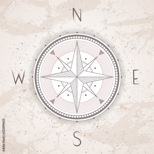 Vector illustration with a vintage compass or wind rose on grunge background. With basic directions North, East, South and West.