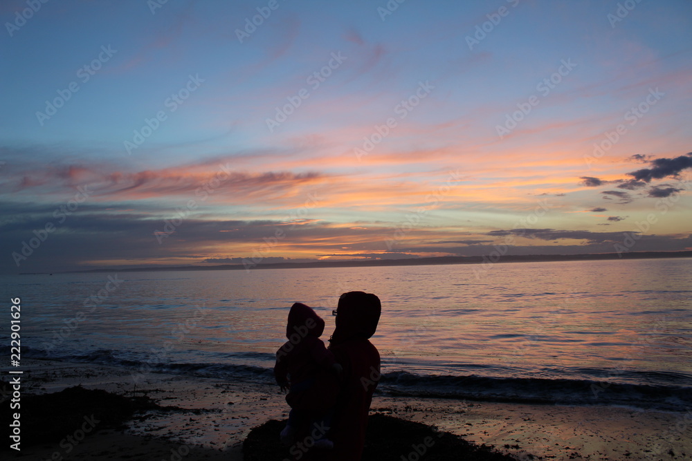 Mother and Child enjoying un-edited sunset at Red Rocks, Phillip Island, Australia Mother and Child enjoying un-edited sunset at Red Rocks, Phillip Island, Australia