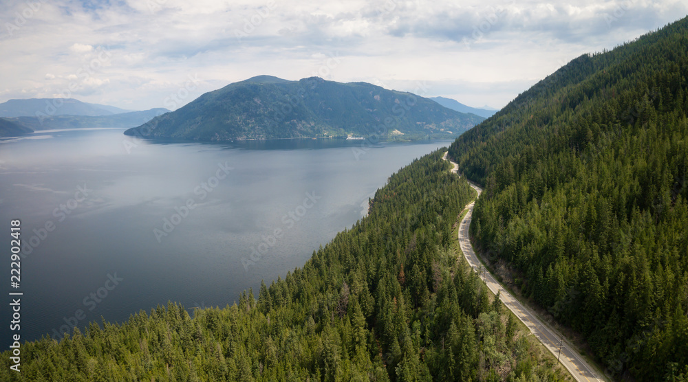 Aerial view of Trans-Canada Highway during a vibrant sunny summer day. Taken near Shuswap Lake, Sicamous, BC, Canada.