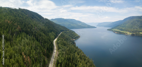 Aerial view of Trans-Canada Highway during a vibrant sunny summer day. Taken near Shuswap Lake, Sicamous, BC, Canada. photo