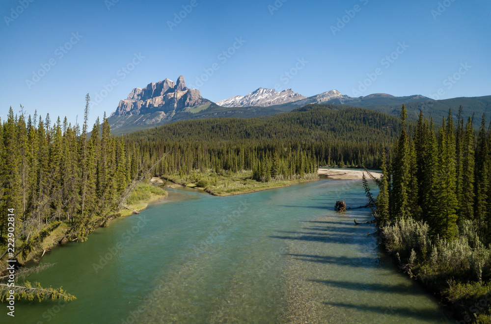 Beautiful aerial panoramic landscape view of Canadian Rockies during a vibrant sunny day. Taken in Banff, Alberta, Canada.