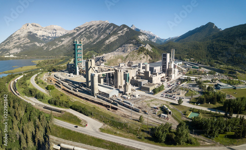 Aerial view of an industrial site in the Canadian Rockies during a vibrant sunny summer day. Taken near Calgary, Alberta, Canada.