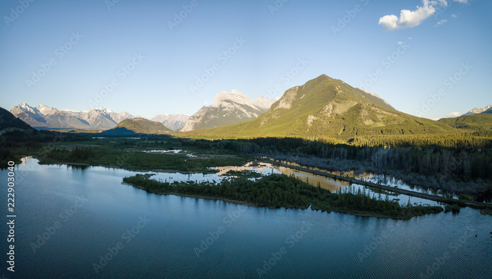 Aerial panoramic view of Vermilion Lakes during a vibrant summer sunset. Taken in Banff, Alberta, Canada.