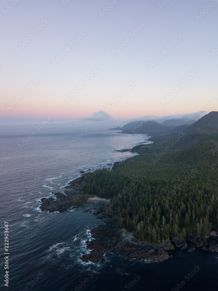 Beautiful aerial seascape view of Pacific Ocean Coast during a vibrant summer sunrise. Taken at Grant Bay, Northern Vancouver Island, BC, Canada.