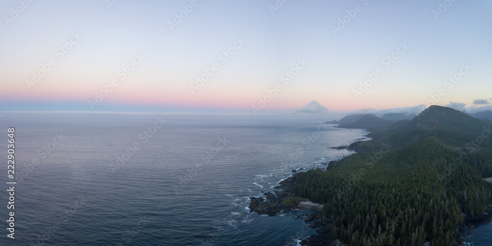 Beautiful aerial panoramic seascape view of Pacific Ocean Coast during a vibrant summer sunrise. Taken at Grant Bay, Northern Vancouver Island, BC, Canada.