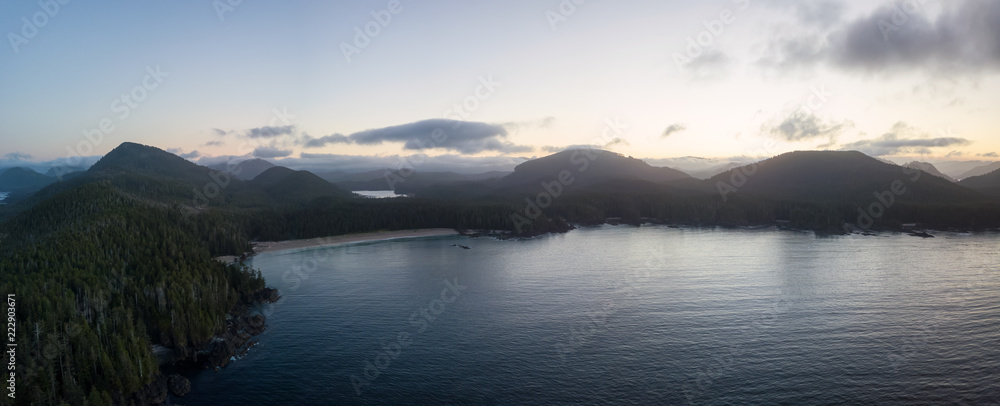 Beautiful aerial panoramic seascape view of Pacific Ocean Coast during a vibrant summer sunrise. Taken at Grant Bay, Northern Vancouver Island, BC, Canada.