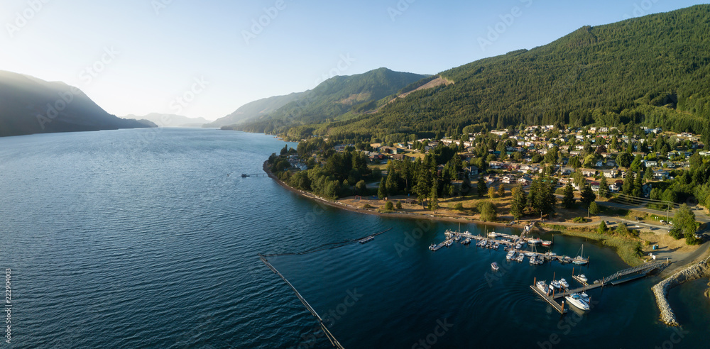 Fototapeta premium Aerial panoramic view of a small town, Port Alice, during a sunny summer sunset. Located in Northern Vancouver Island, BC, Canada.