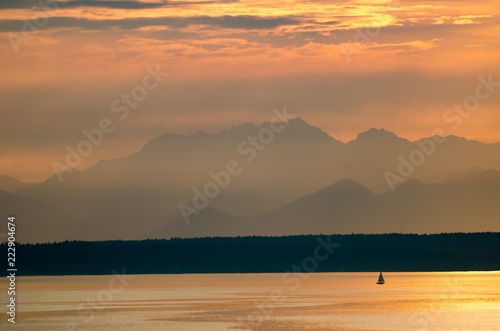 Lone Sailboat and the Olympic Mountains