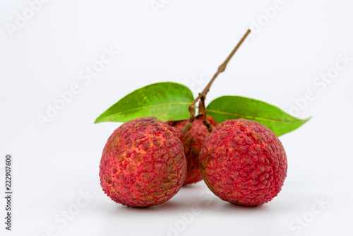 Three lychee fruit on white background