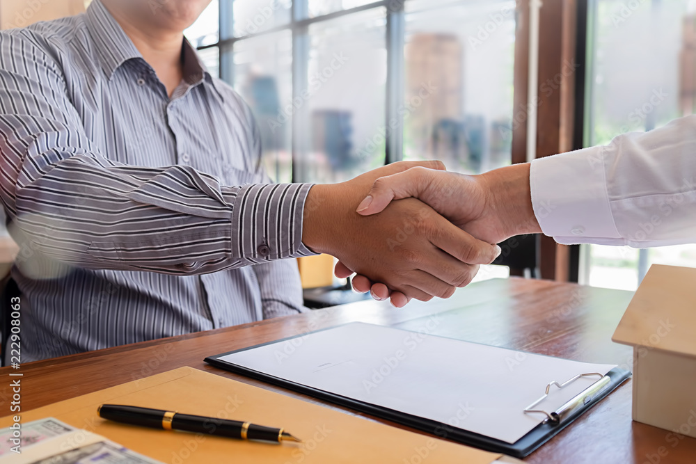 Real estate agent and customer signing contract to buy house, insurance or loan real estate. Real estate agent and customer signing contract to buy house, insurance or loan real estate.