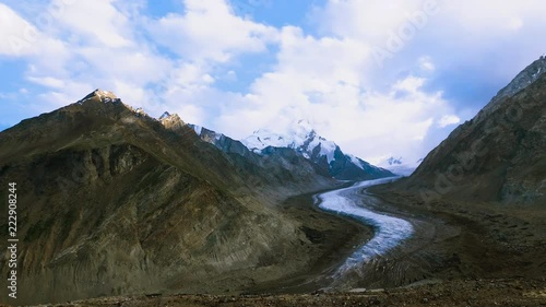 Beautiful landscpe of Drang-Drung Glacier with flowers, Mountain glacier on zanskar road at Himalaya Range, Zanskar Range, Pensi La, Jammu and Kashmir, Ladakh India. photo