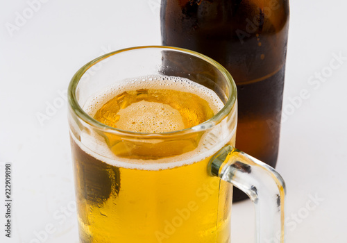 Mug with beer on white background