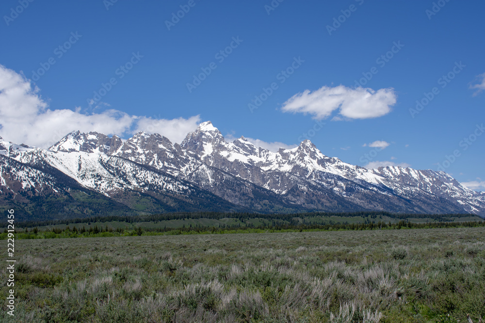 tetons and clouds