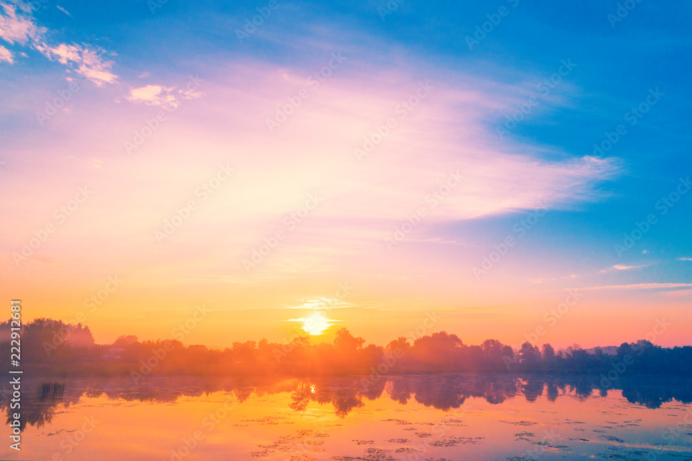 Magical sunrise over the lake. Misty morning, rural landscape Magical sunrise over the lake. Misty morning, rural landscape