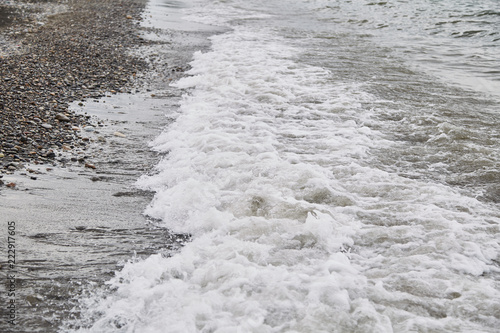 The black sea beach. Pebble beach. Waves.
