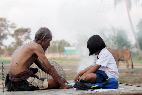 Oldman and girl in the countryside.