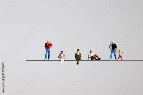 The miniature of various men on the cliff. photo