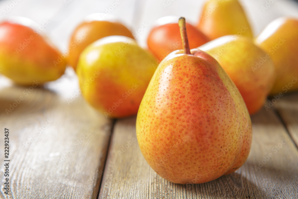 Ripe pears on rustic wooden table