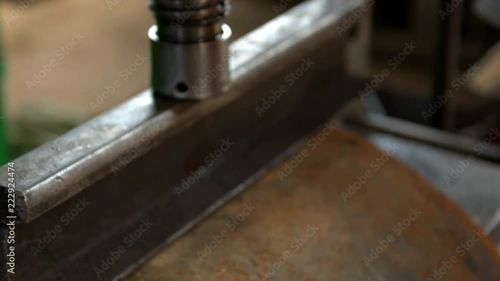 This working at the factory with a hydraulic press This working at the factory with a hydraulic press