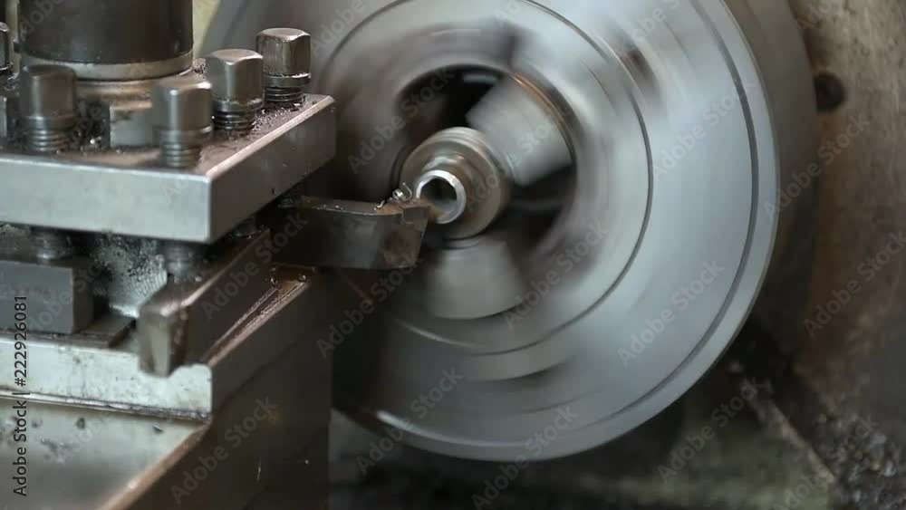 a worker working on a lathe a worker working on a lathe