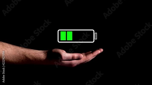 Hand showing Battery Charge icon on black background