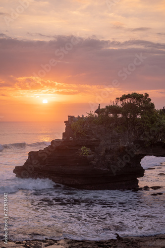 Sunset at Pura Batu Bolong temple on the beatiful rock in Bali