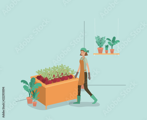 woman with plants vivarium in shelving