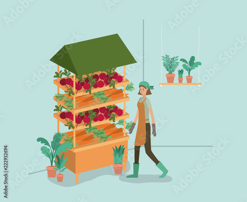 woman with plants vivarium in kiosk