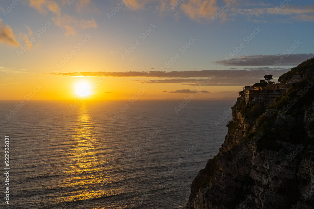 Golden sunset on Amalfi coast cliff