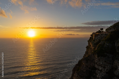 Golden sunset on Amalfi coast cliff