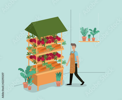 man with plants vivarium in kiosk