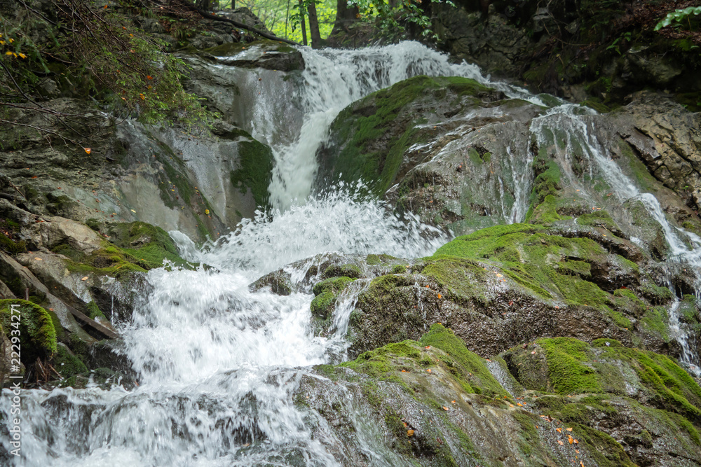 An impressive waterfall in a gorge in Austria An impressive waterfall in a gorge in Austria