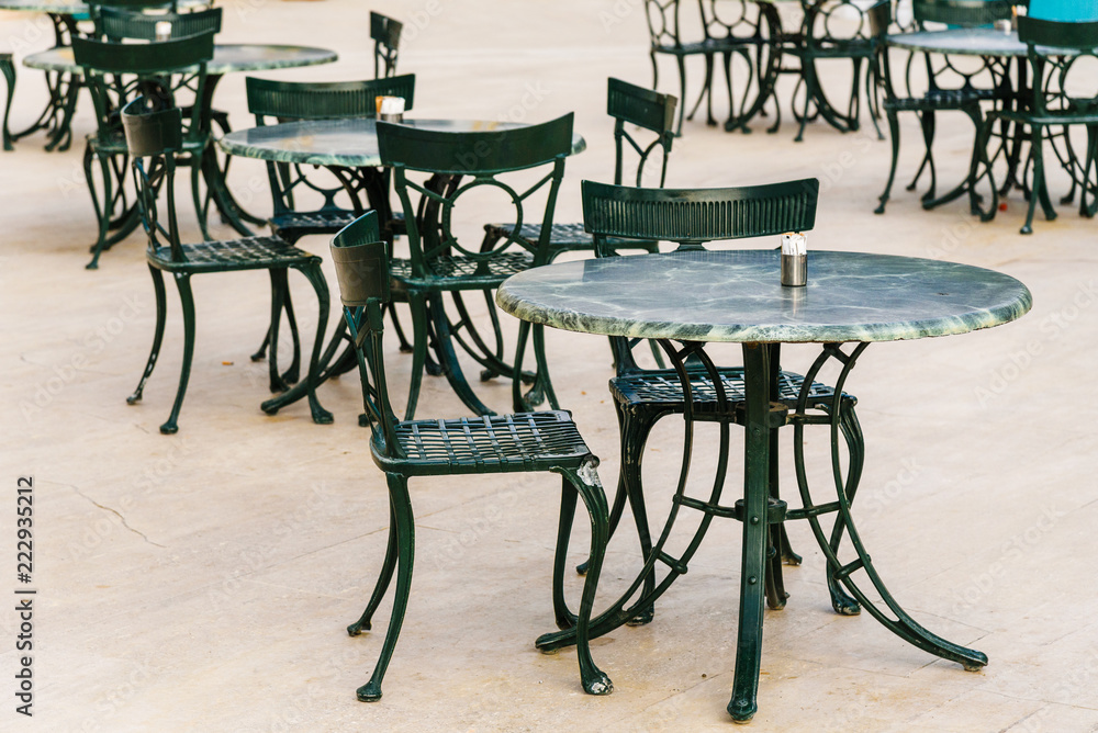 Street cafes, empty tables and chairs on the street