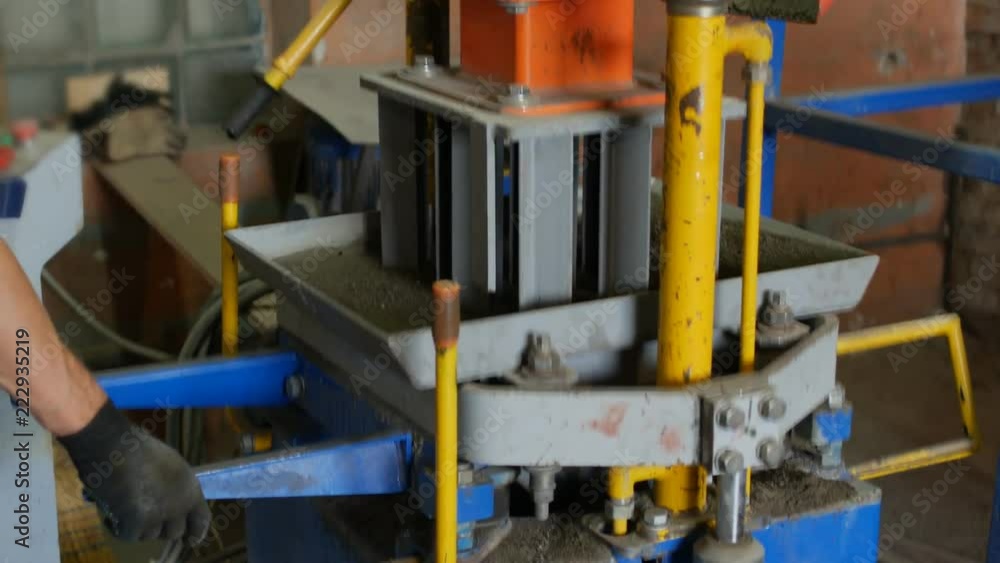 Production process of concrete tile blocks in brick form for road surface cover. Vibrocompression and compacting of semi-dry concrete mixtures by press machine Production process of concrete tile blocks in brick form for road surface cover. Vibrocompression and compacting of semi-dry concrete mixtures by press machine
