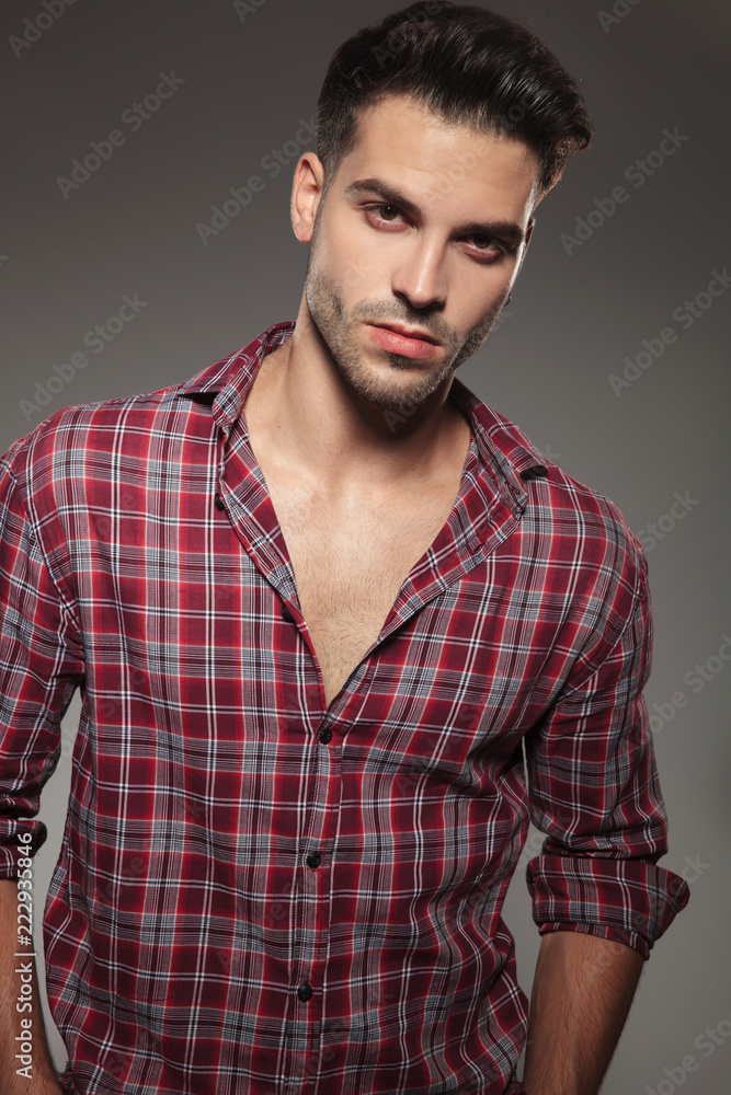 Fototapeta premium portrait of a young casual man in plaid shirt