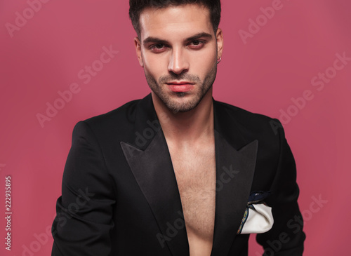 Tableau sur toile portrait of handsome young man wearing an undone black tuxedo