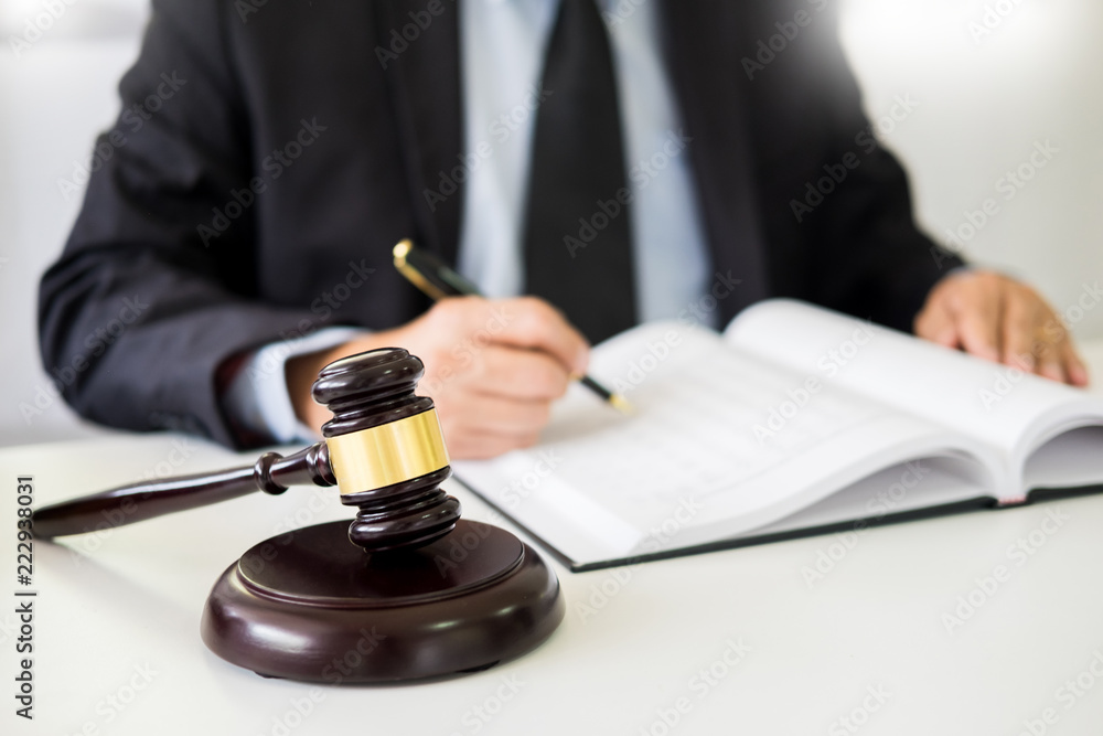 gavel and sound block of justice law and lawyer working on wooden desk background. gavel and sound block of justice law and lawyer working on wooden desk background.