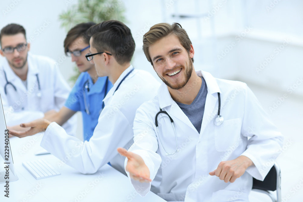 friendly doctor making a welcome gesture friendly doctor making a welcome gesture