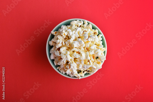 Popcorn in a bowl on red
