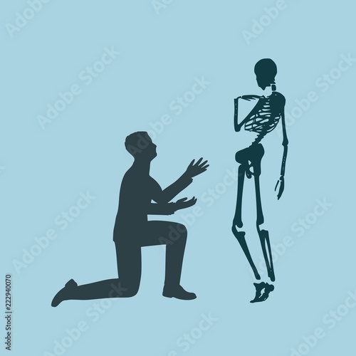 Silhouette of man in prayer pose. Man asking skeleton to forgive him.