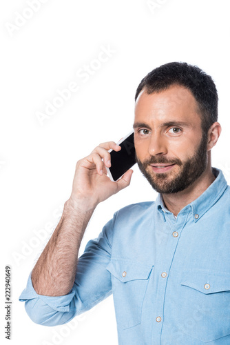 bearded man talking on smartphone isolated on white