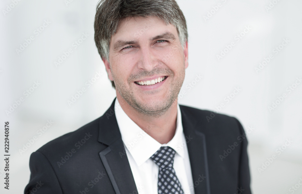 Portrait of a smiling successful businessman. Portrait of a smiling successful businessman.