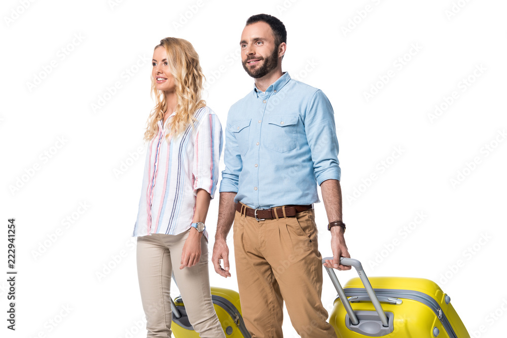 happy couple with yellow baggage isolated on white happy couple with yellow baggage isolated on white