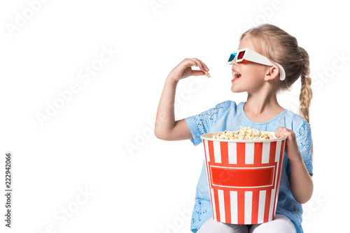 Canvas Print child eating popcorn isolated on white